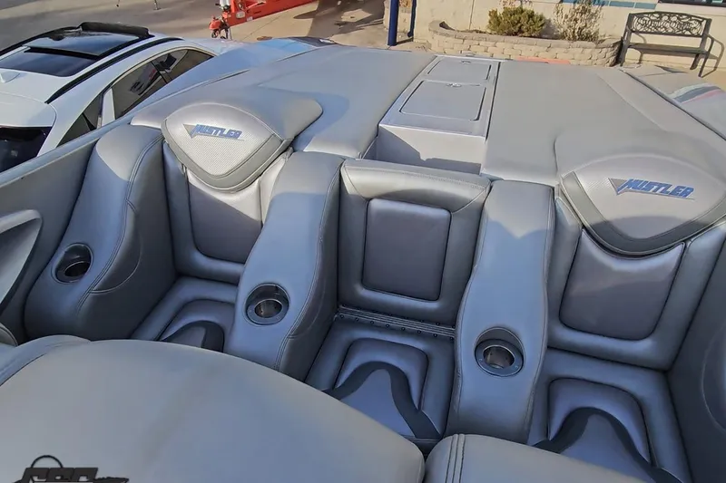 Slide: The Image of 2007 Hustler 41 Razor boat interior with gray leather seats and cup holders. - 96