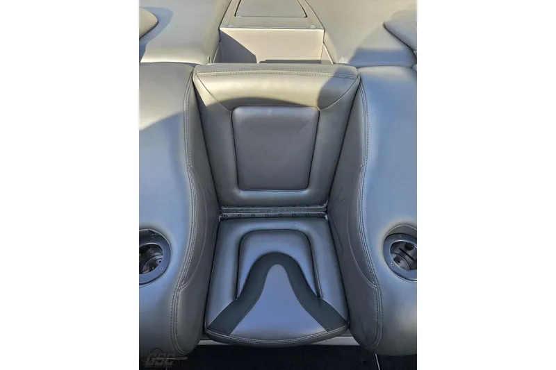 Slide: The Image of 2007 Hustler 41 Razor boat interior seating with gray upholstery and cup holders. - 97