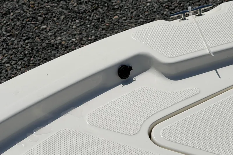 Slide: The Image of 2018 Mako 19 CPX boat deck with textured surface and cleat. - 22