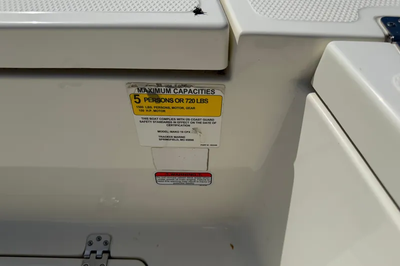 Slide: The Image of 2018 Mako 19 CPX boat capacity label, maximum 5 persons or 720 lbs. - 24