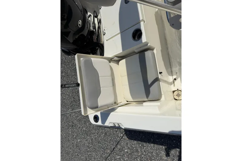 Slide: The Image of 2018 Mako 19 CPX boat seat with gray and white upholstery. - 30