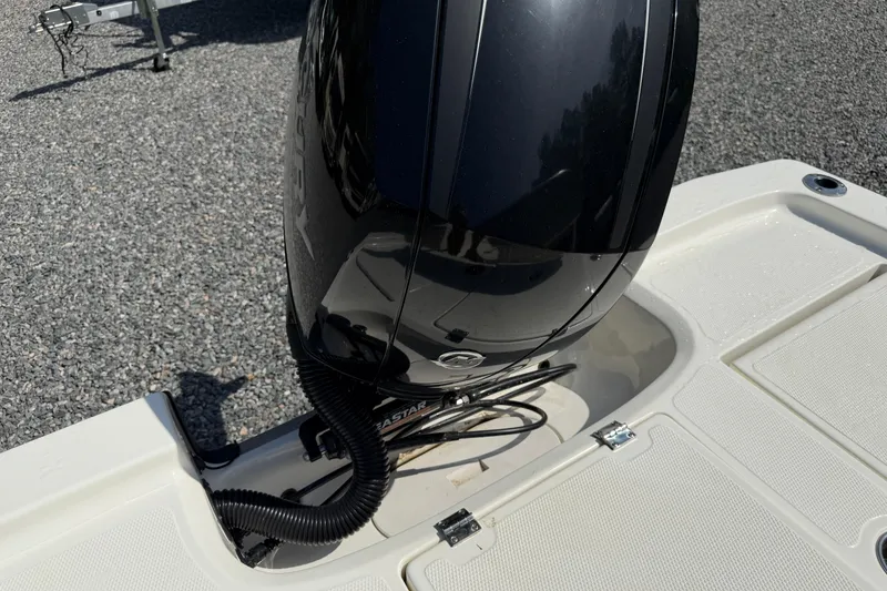 Slide: The Image of 2018 Mako 19 CPX boat with a black Mercury outboard motor. - 32