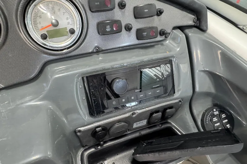 Slide: The Image of Dashboard of a 2012 Yamaha Boats SX210 with gauges and controls. - 4