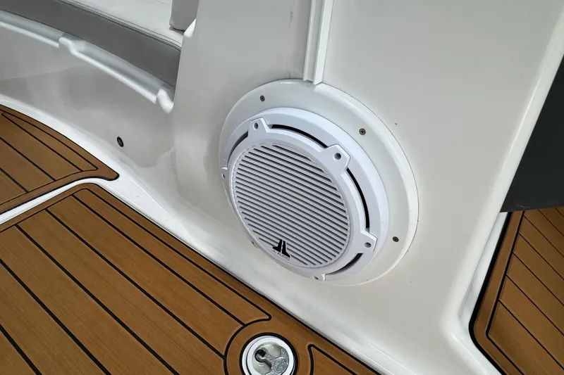 Slide: The Image of 2012 Yamaha SX210 boat interior with speaker and teak-style flooring. - 6