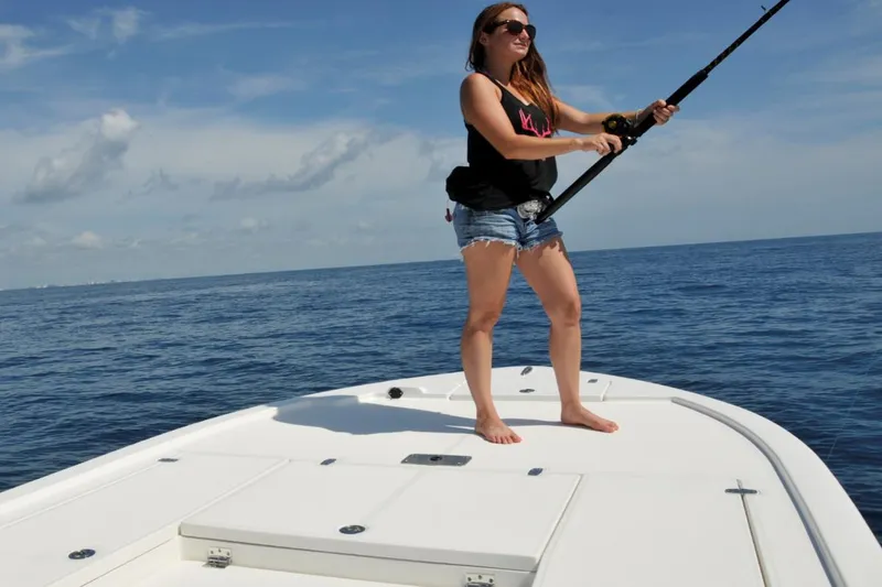 Slide: The Image of Manufacturer Provided Image: Woman fishing on a 2025 Sea Born FX24 Bay boat in open water. - 3
