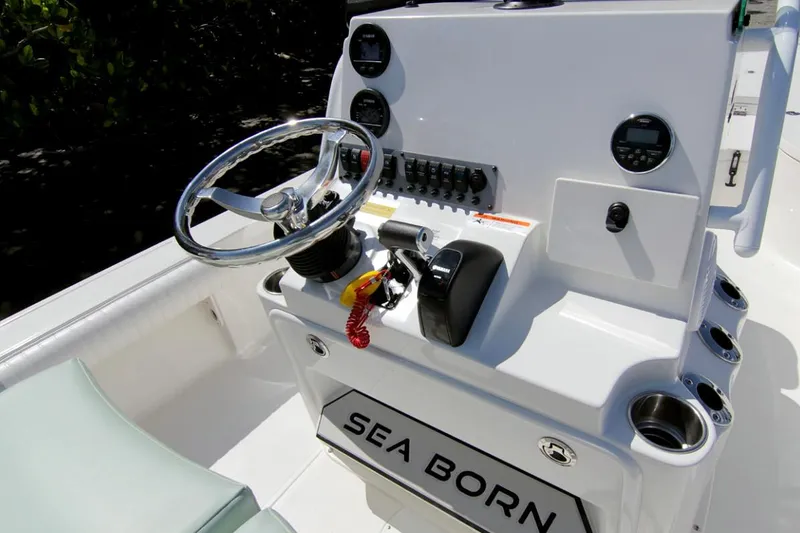 Slide: The Image of Manufacturer Provided Image: 2025 Sea Born FX24 Bay boat console with steering wheel and controls. - 5