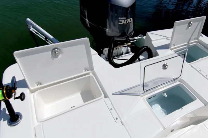 Slide: The Image of Manufacturer Provided Image: 2025 Sea Born FX24 Bay boat with open storage compartments and Yamaha 300 engine. - 7