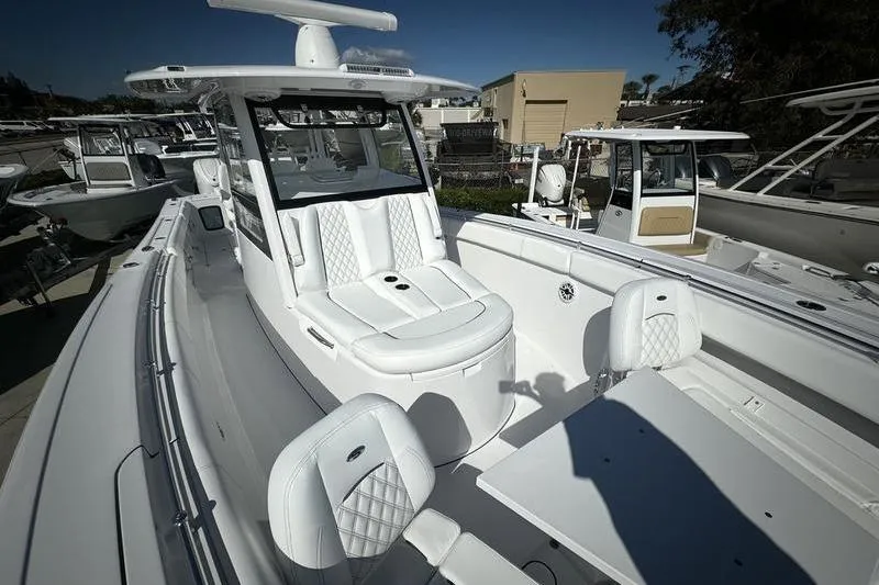 Slide: The Image of 2025 Sportsman Open 352 Center Console boat with luxurious seating and modern design. - 10