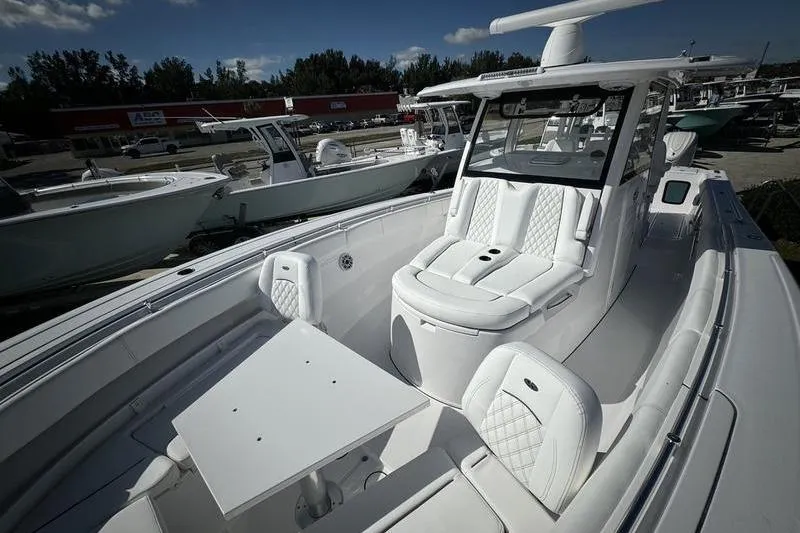 Slide: The Image of 2025 Sportsman Open 352 Center Console boat with luxurious seating and sleek design. - 11