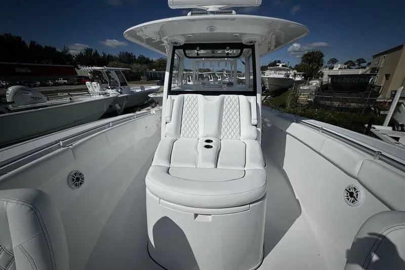 Slide: The Image of 2025 Sportsman Open 352 Center Console boat with luxurious seating and sleek design. - 14