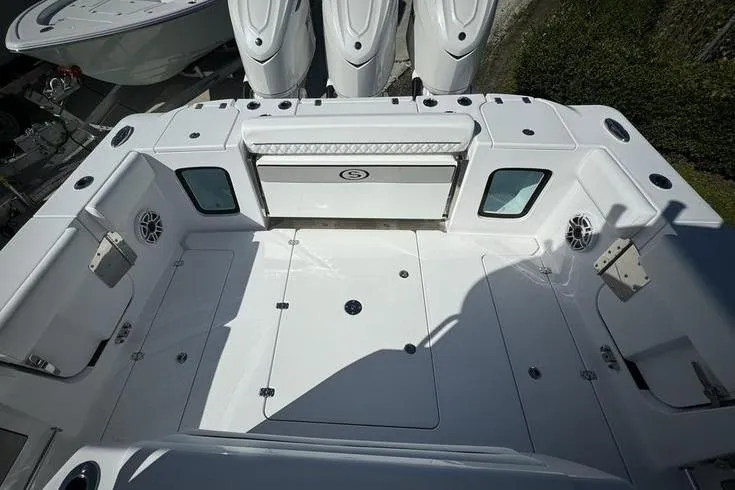 Slide: The Image of 2025 Sportsman Open 352 Center Console boat deck with storage and seating. - 19