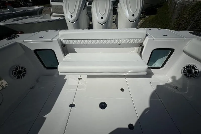 Slide: The Image of 2025 Sportsman Open 352 Center Console boat interior with seating and storage compartments. - 21