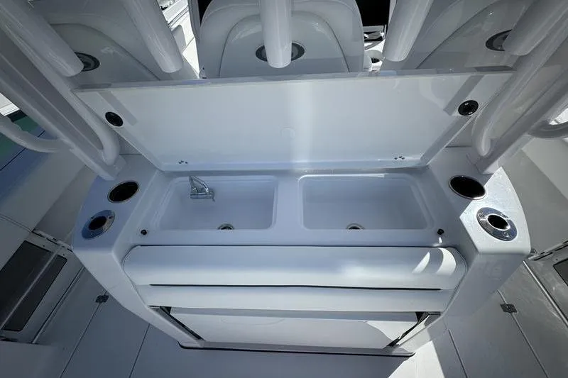 Slide: The Image of 2025 Sportsman Open 352 Center Console boat with dual sinks and rod holders. - 24