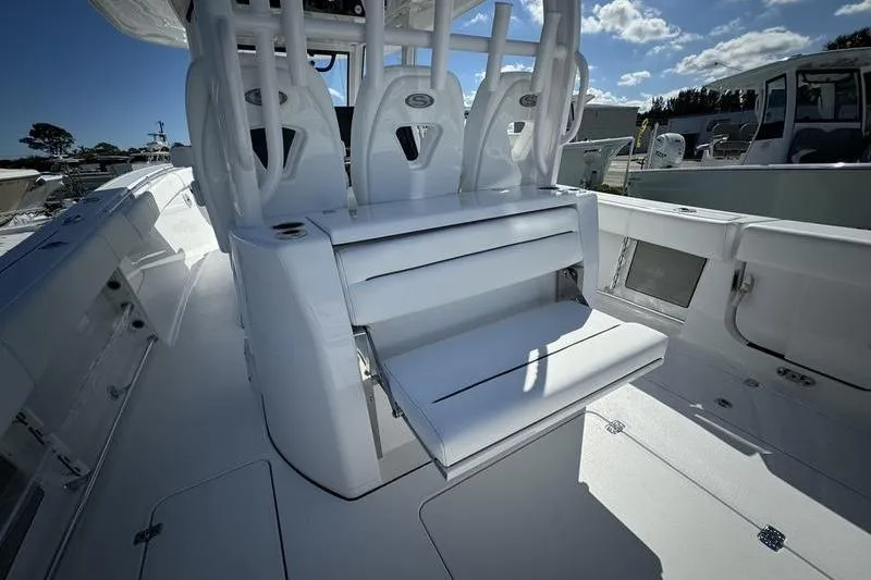 Slide: The Image of 2025 Sportsman Open 352 Center Console boat interior with seating and storage features. - 25