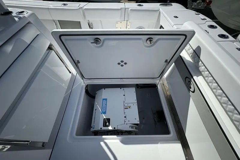 Slide: The Image of 2025 Sportsman Open 352 Center Console with open storage compartment. - 26