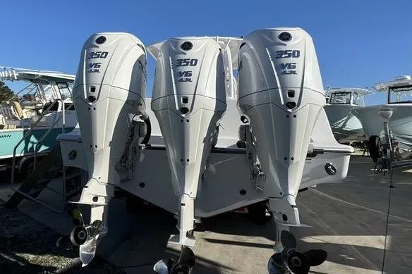 Slide: The Image of 2025 Sportsman Open 352 Center Console with triple 350 V6 outboard engines. - 3