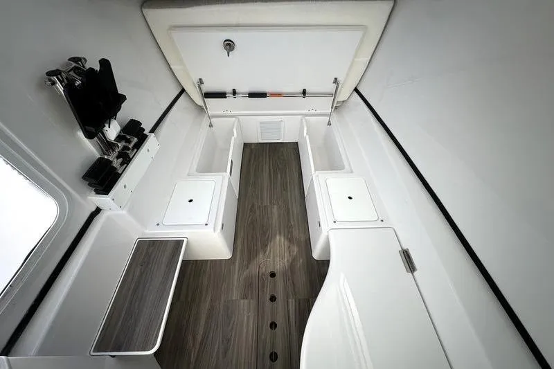 Slide: The Image of 2025 Sportsman Open 352 Center Console interior with sleek design and wood flooring. - 33