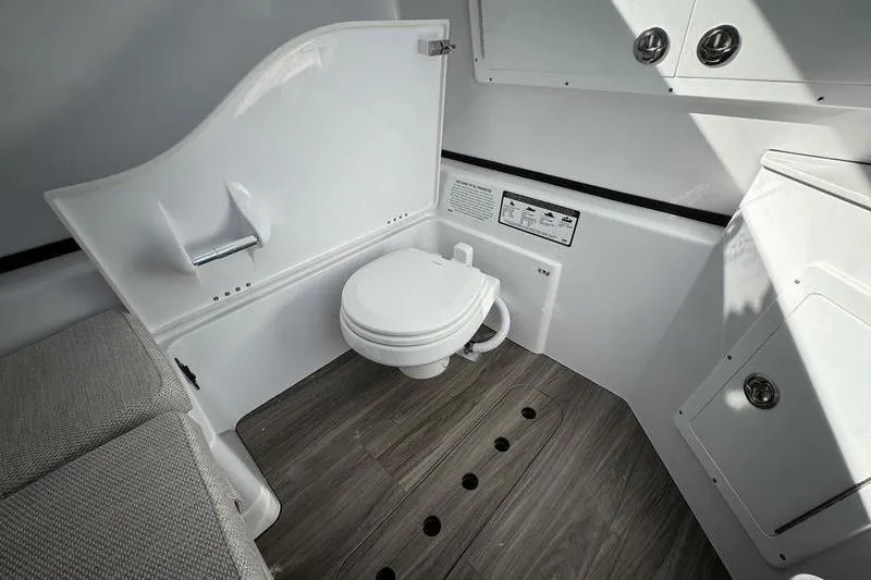 Slide: The Image of 2025 Sportsman Open 352 Center Console boat interior with modern bathroom amenities. - 40