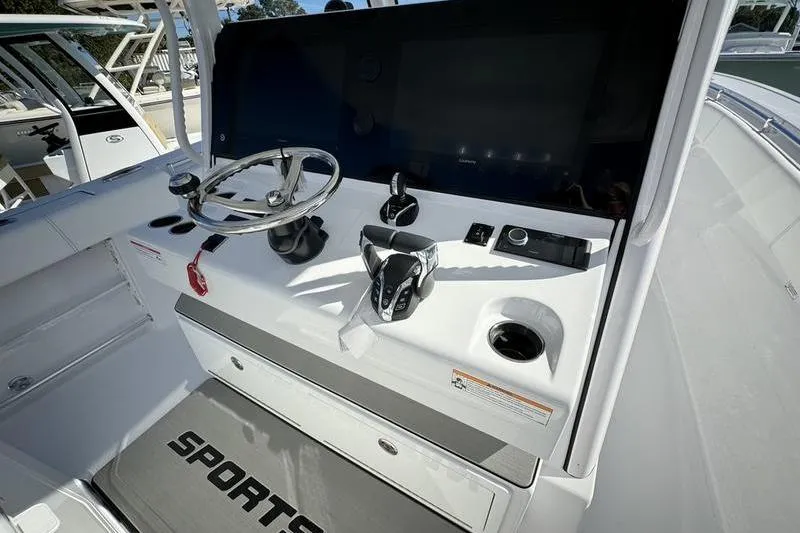 Slide: The Image of 2025 Sportsman Open 352 Center Console helm with steering wheel and controls. - 43