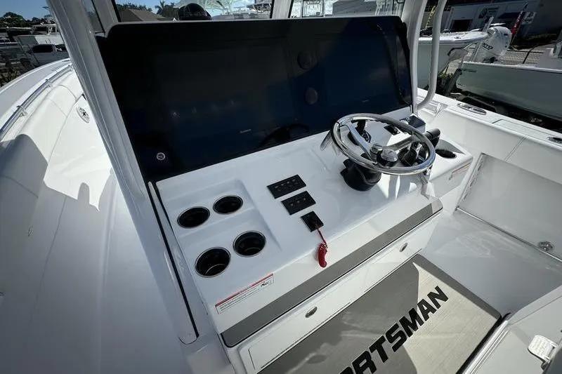 Slide: The Image of 2025 Sportsman Open 352 Center Console helm with steering wheel and controls. - 44