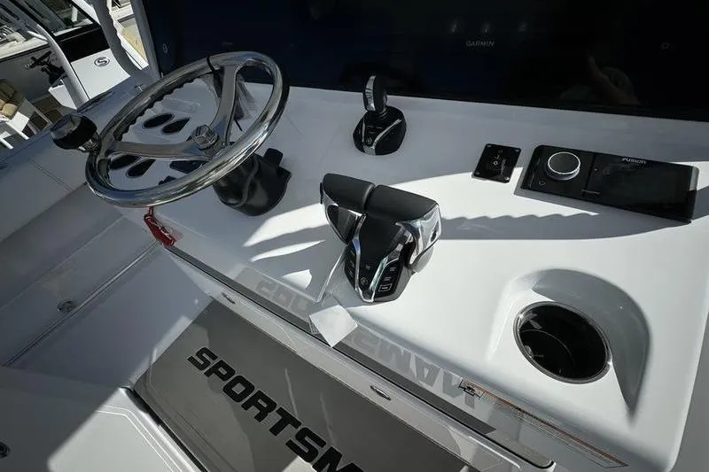 Slide: The Image of 2025 Sportsman Open 352 Center Console helm with steering wheel and controls. - 45