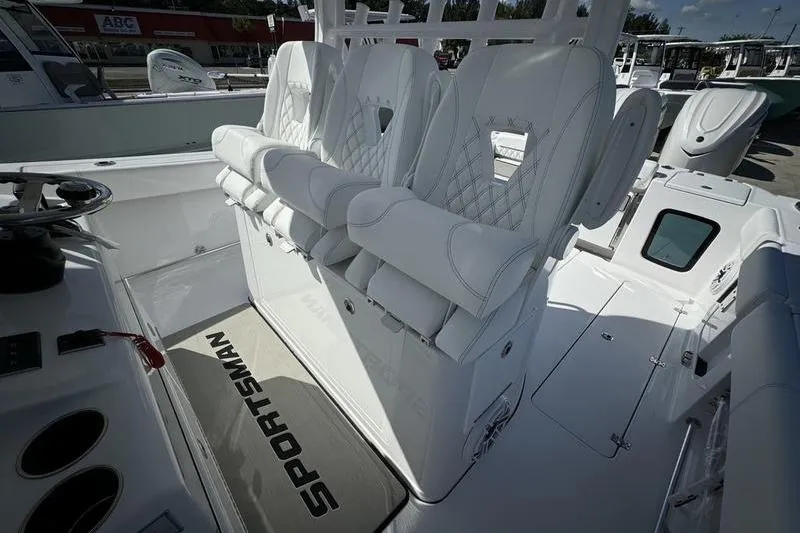 Slide: The Image of 2025 Sportsman Open 352 Center Console with luxurious white seating and helm area. - 46