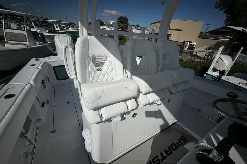Slide: The Image of 2025 Sportsman Open 352 Center Console with luxurious white seating and modern design. - 47