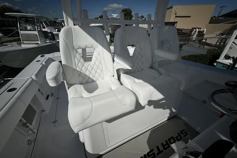 Slide: The Image of 2025 Sportsman Open 352 Center Console with luxurious white seating. - 48