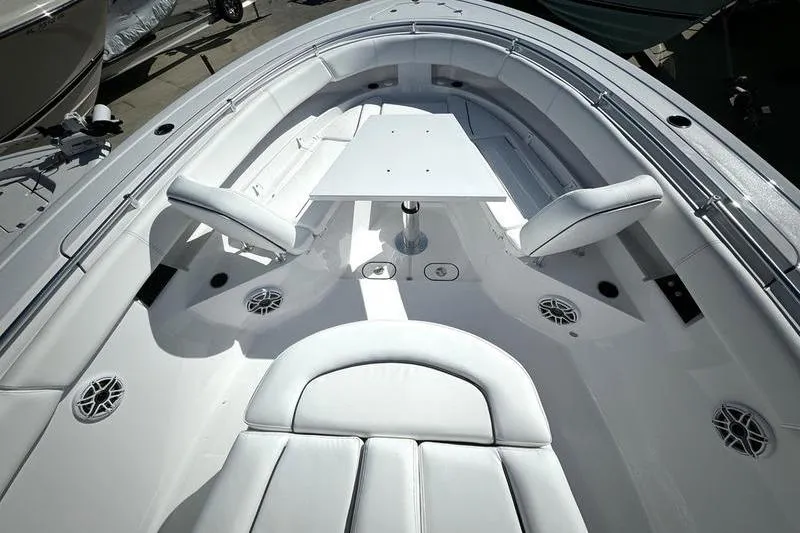 Slide: The Image of 2025 Sportsman Open 352 Center Console boat interior with seating and table. - 5