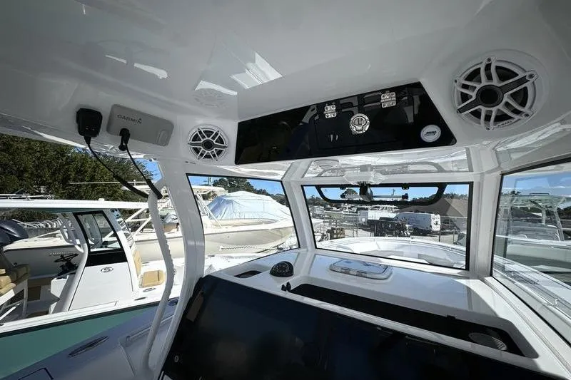 Slide: The Image of 2025 Sportsman Open 352 Center Console interior with advanced navigation and audio systems. - 52