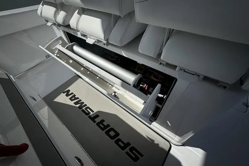 Slide: The Image of 2025 Sportsman Open 352 Center Console boat interior with storage compartment open. - 54