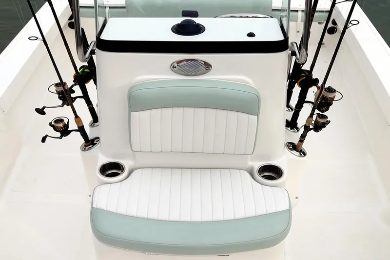 Slide: The Image of Manufacturer Provided Image: 2025 Sea Born FX22 Bay boat interior with fishing rod holders and cushioned seating. - 5