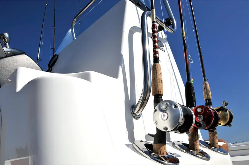 Slide: The Image of Manufacturer Provided Image: 2025 Sea Born FX22 Bay boat with fishing rods against a clear blue sky. - 8