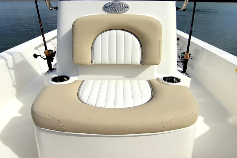 Slide: The Image of Manufacturer Provided Image: 2025 Sea Born FX21 Bay boat seat with beige and white upholstery, featuring cup holders. - 4