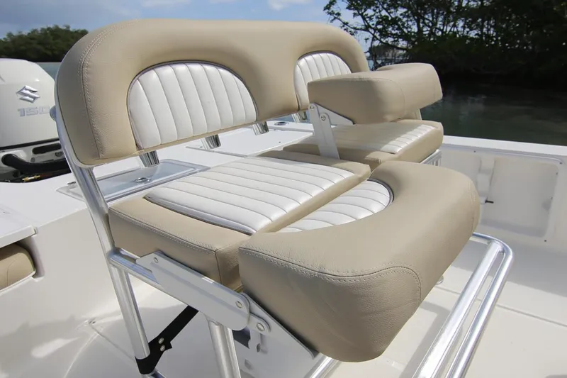 Slide: The Image of Manufacturer Provided Image: 2025 Sea Born FX21 Bay boat seating with beige and white cushioned design. - 9