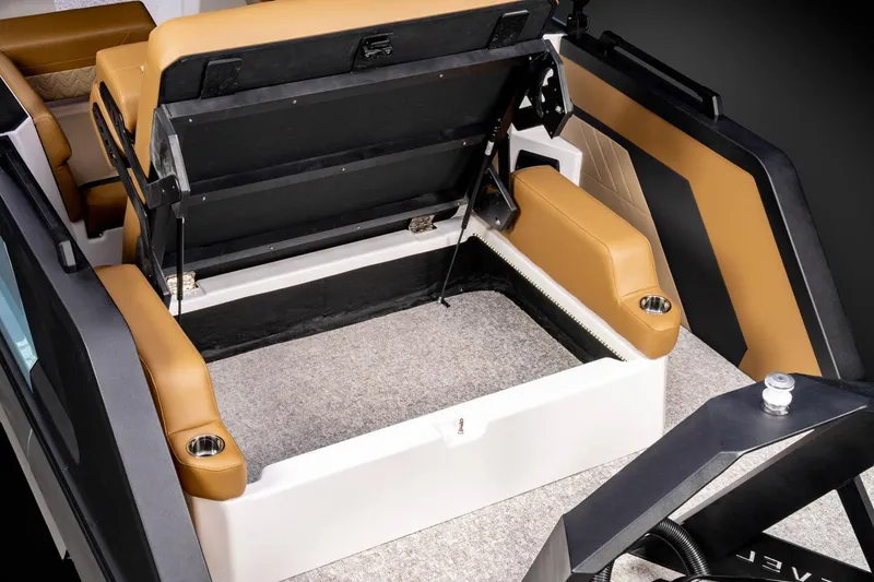Slide: The Image of Manufacturer Provided Image: 2026 Revel RS25 boat interior with tan seats and storage compartment. - 14