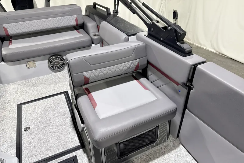 Slide: The Image of 2026 Revel RS25 boat interior with gray and red seating, modern design. - 6