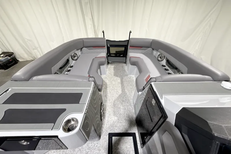 Slide: The Image of 2026 Revel RS25 boat interior with sleek gray seating and modern design elements. - 8