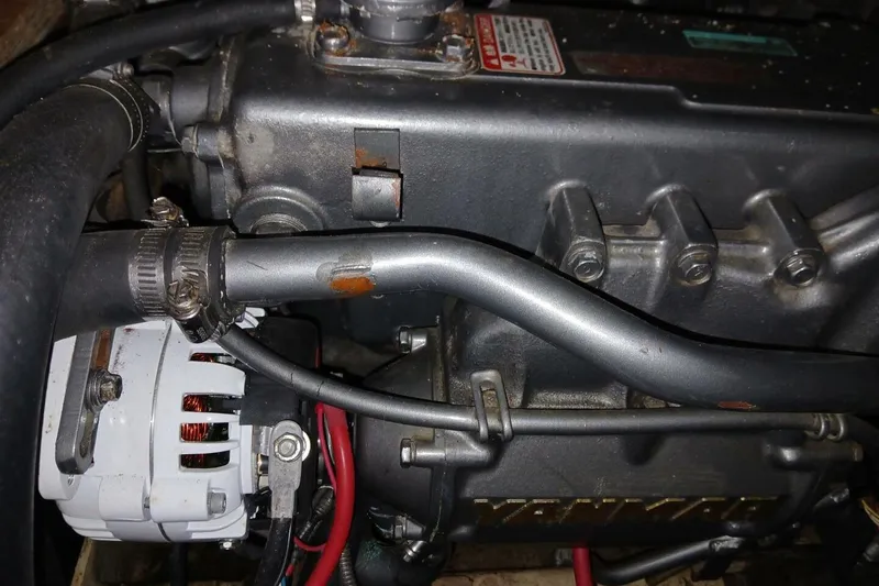 Slide: The Image of Engine components of a 1976 Islander Freeport sailboat, featuring Yanmar parts. - 49