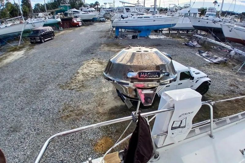 Slide: The Image of 1976 Islander Freeport sailboat with Magma grill in a boatyard. - 57