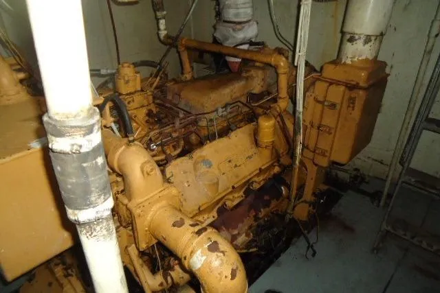 Slide: The Image of Engine room of a 1973 Commercial Boats Shrimp Trawler, featuring a vintage marine engine. - 3
