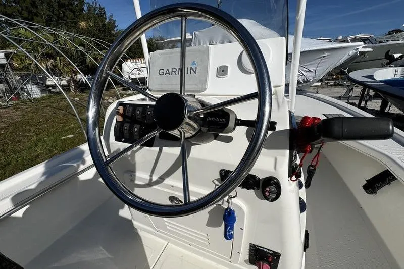 Slide: The Image of Steering wheel of 2022 Mako 18 LTS boat with Garmin navigation system. - 21