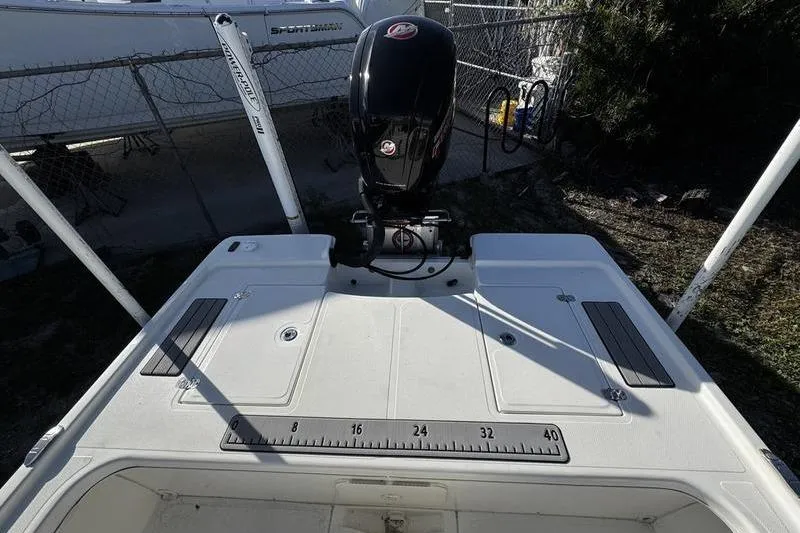 Slide: The Image of 2022 Mako 18 LTS boat with outboard motor and measuring ruler on deck. - 22