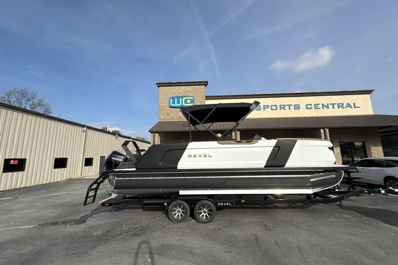 The Image of 2026 Revel RS25 boat on trailer under sunny sky. - 0