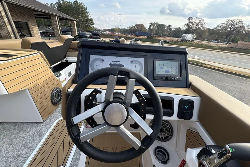 Slide: The Image of Steering console of 2026 Revel RS25 boat with modern dashboard and controls. - 16