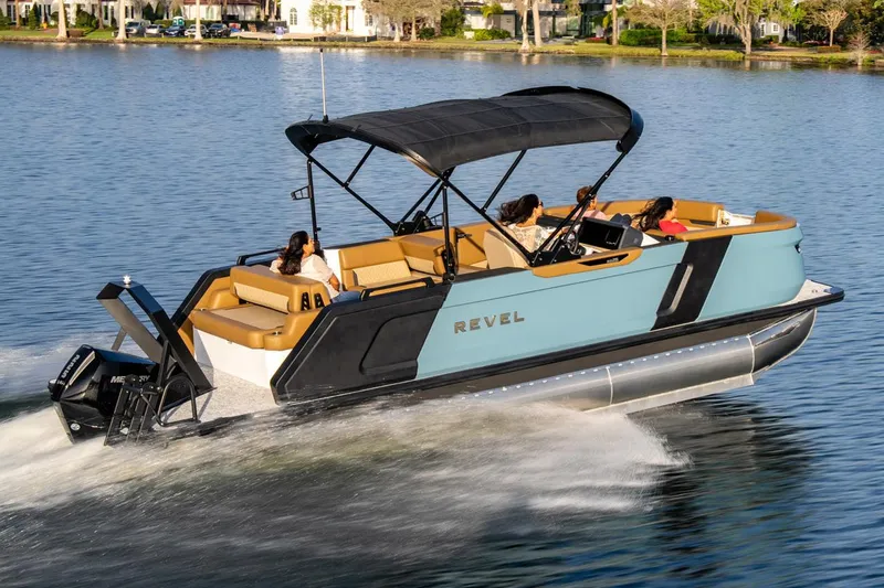 Slide: The Image of Manufacturer Provided Image: 2026 Revel RS25 pontoon boat cruising on a lake with passengers. - 17