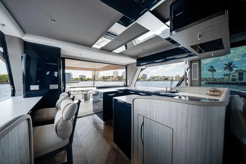 Slide: The Image of Luxurious interior of 2026 Galeon 640 Fly yacht with modern design and waterfront view. - 11