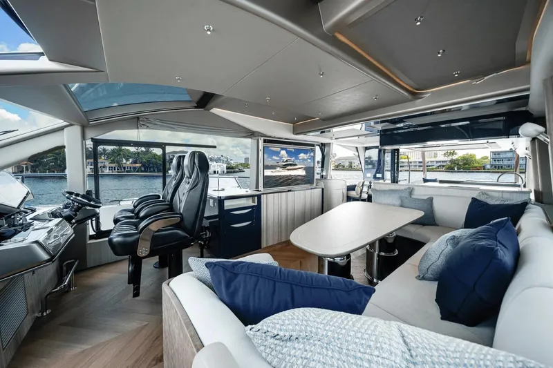 Slide: The Image of Luxurious interior of 2026 Galeon 640 Fly yacht with modern seating and panoramic windows. - 17