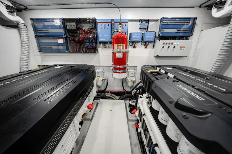 Slide: The Image of Engine room of 2026 Galeon 640 Fly yacht with advanced equipment and fire extinguisher. - 26