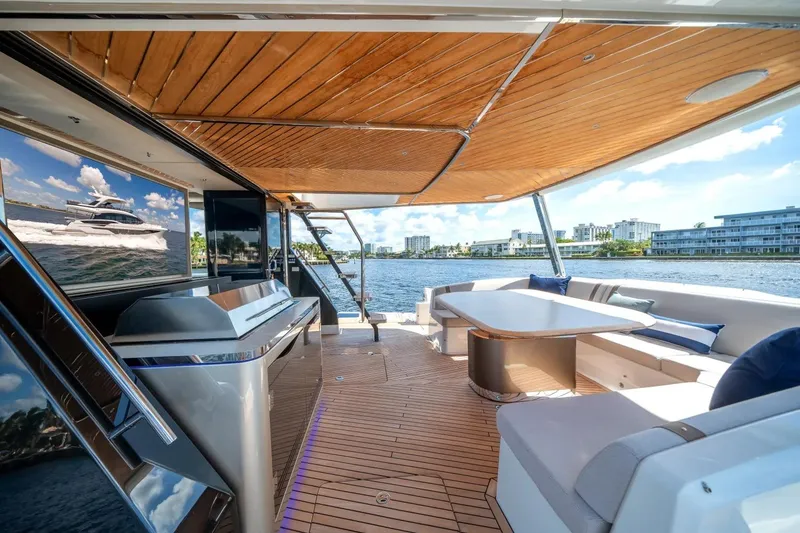 Slide: The Image of Luxurious 2026 Galeon 640 Fly yacht interior with elegant seating and scenic water views. - 8